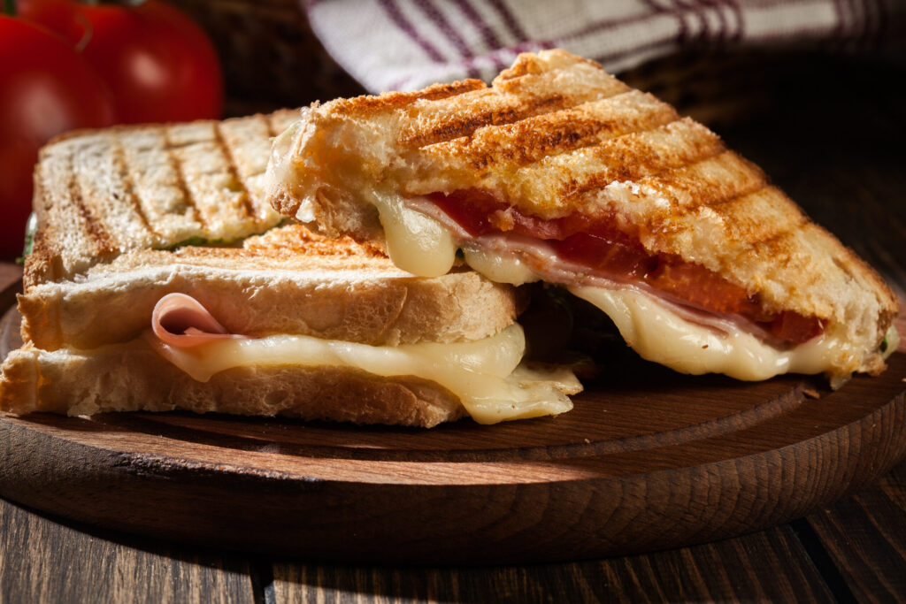 Panini with ham cheese and lettuce sandwich